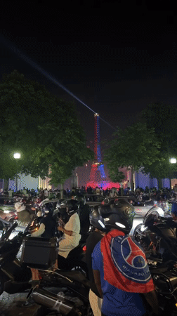 Evening celebrations with fireworks light up Paris streets