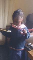 Children in school uniforms captured during morning routine
