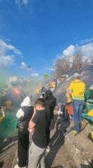 Crowd gathers with flares and smoke in Dobrich, Bulgaria