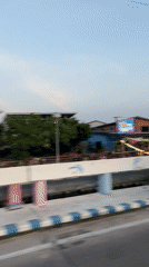 Vehicle captures Pattaya street-to-waterfront transition during golden hour