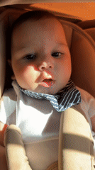 Baby in car seat, red string bracelet, Pleven Bulgaria