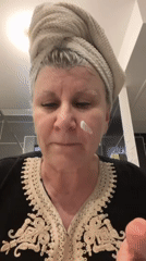 Woman documents evening self-care routine with pets in France
