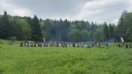 Motorcyclist group gathers in field near Krasnokamsk, smoke observed