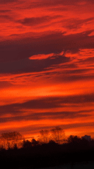 Vivid Red-Orange Sunset Observed in Hawarden, UK