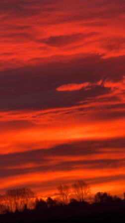 Vivid Red-Orange Sunset Observed in Hawarden, UK