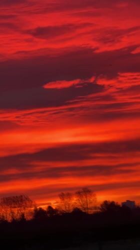 Vivid Red-Orange Sunset Observed in Hawarden, UK