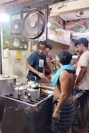 Busy tea stall in full swing on a Dhaka street