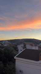 Sunset scenes in Podgorica residential area with parked yellow Fiat