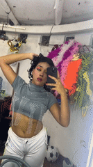 Pink-costumed stage performance and backstage selfies in Porlamar