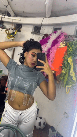 Pink-costumed stage performance and backstage selfies in Porlamar