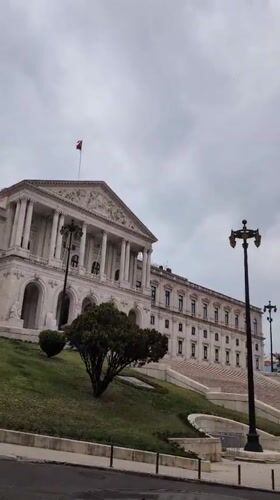 Afternoon documentation of Lisbon's Parliament district during cloudy weather