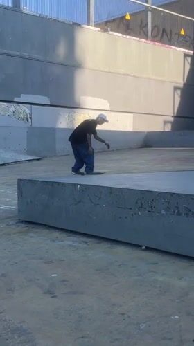 Skater mid-trick at a Barcelona skatepark