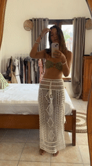 Woman takes mirror selfie in bedroom in Kuta Selatan
