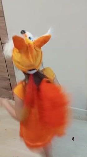 Child in fox costume dances in Russian town