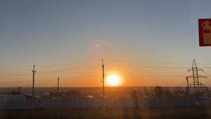 Sunset captured over Russian town with power lines visible