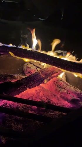 Campfire burns at night in Arad, Israel