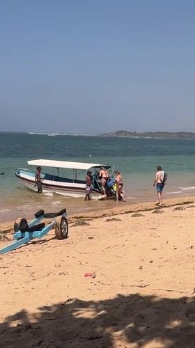 Watersports and beach activity on a busy Bali morning