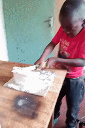 Young people play volleyball, celebrate with cake in Turbo, Kenya