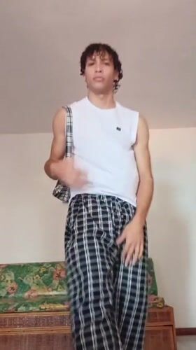 Young man documents outfit changes in Porlamar home