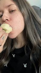 Woman enjoys chocolate strawberries on sofa in Khimki