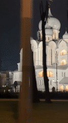 Illuminated Orthodox church observed at night in Saint Petersburg