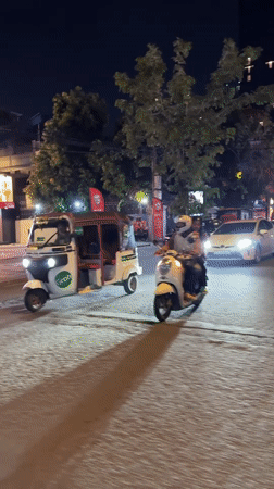 Phnom Penh nighttime traffic across two central districts