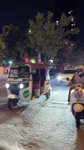 Phnom Penh nighttime traffic across two central districts