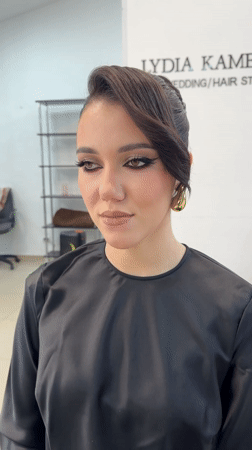 Woman gets hair styled at salon in Chaikovsky, Russia