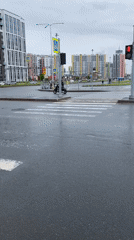 Morning street activity captured during rainy weather in Saint Petersburg