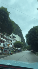 Dawn drive through Guilin village shows cracked roads, white buildings