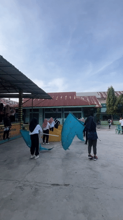 Students drill, play melodicas, and exercise at Lhokseumawe school