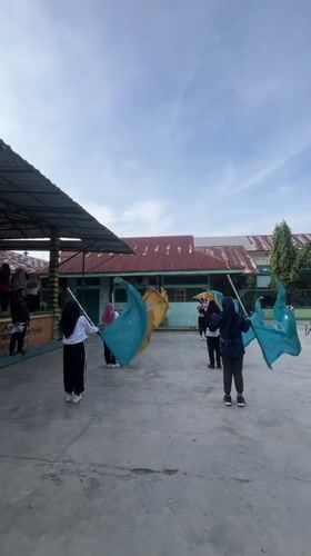 Students drill, play melodicas, and exercise at Lhokseumawe school