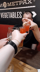 Restaurant patrons enjoy drinks and dining during evening hours
