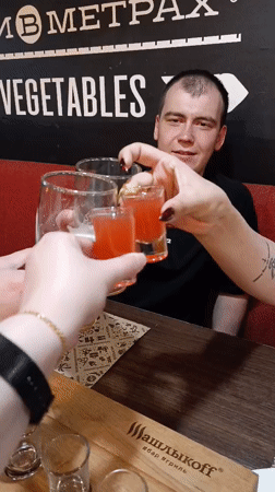 Restaurant patrons enjoy drinks and dining during evening hours