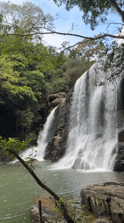 Morning waterfall documentation in Poththatawela, Sri Lanka shows rainbow mist