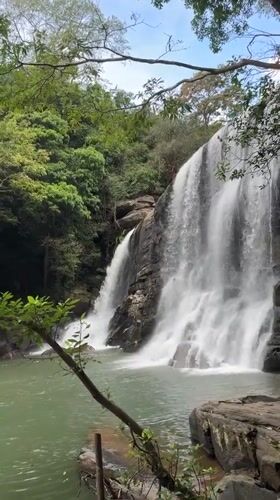 Morning waterfall documentation in Poththatawela, Sri Lanka shows rainbow mist