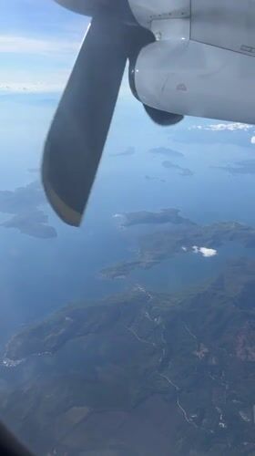 Aerial view captures Philippine islands from airplane window