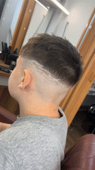 Boy gets fresh haircut at Bulgarian barbershop