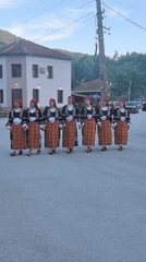 Folk dancers perform in traditional costumes in Beli Osam