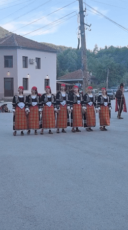 Folk dancers perform in traditional costumes in Beli Osam