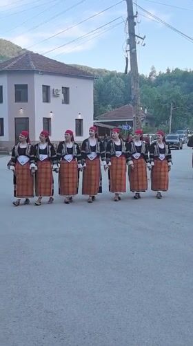 Folk dancers perform in traditional costumes in Beli Osam
