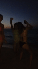 Evening beach gathering with dancing observed in Juan Griego