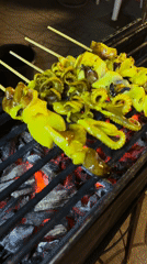 Night market vendors serve food in Choeng Thale Thailand