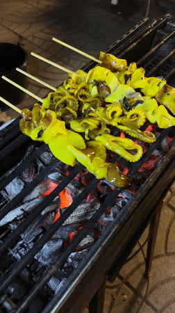Night market vendors serve food in Choeng Thale Thailand