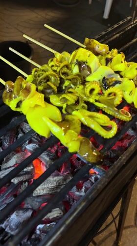 Night market vendors serve food in Choeng Thale Thailand