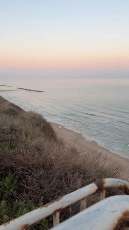 Dawn beach scenes captured along Netanya coastline with recreational activities