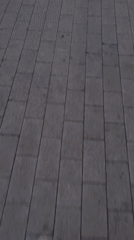 Person walks across wooden-to-tile walkway in Bor, Russia