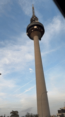 Telecommunications tower photographed against cloudy sky in Madrid