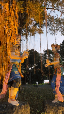 Illuminated Balinese cultural displays documented at Kuta Selatan park