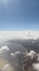 Aerial footage captures Almada's coastline under blue skies